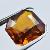 8.35 carat square-cut orange sapphire, a glistening and natural loose gemstone.